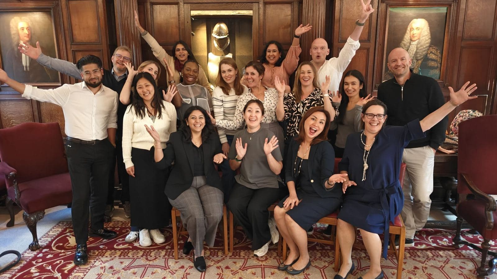 A workshop group cheering together at the end of a day