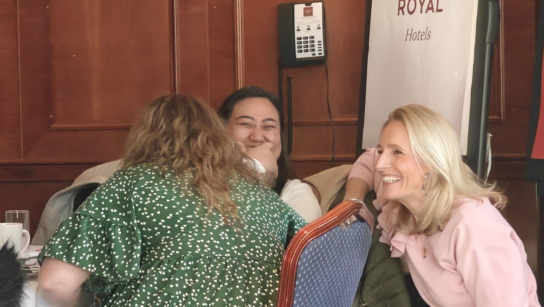 Participants laughing together during a workshop