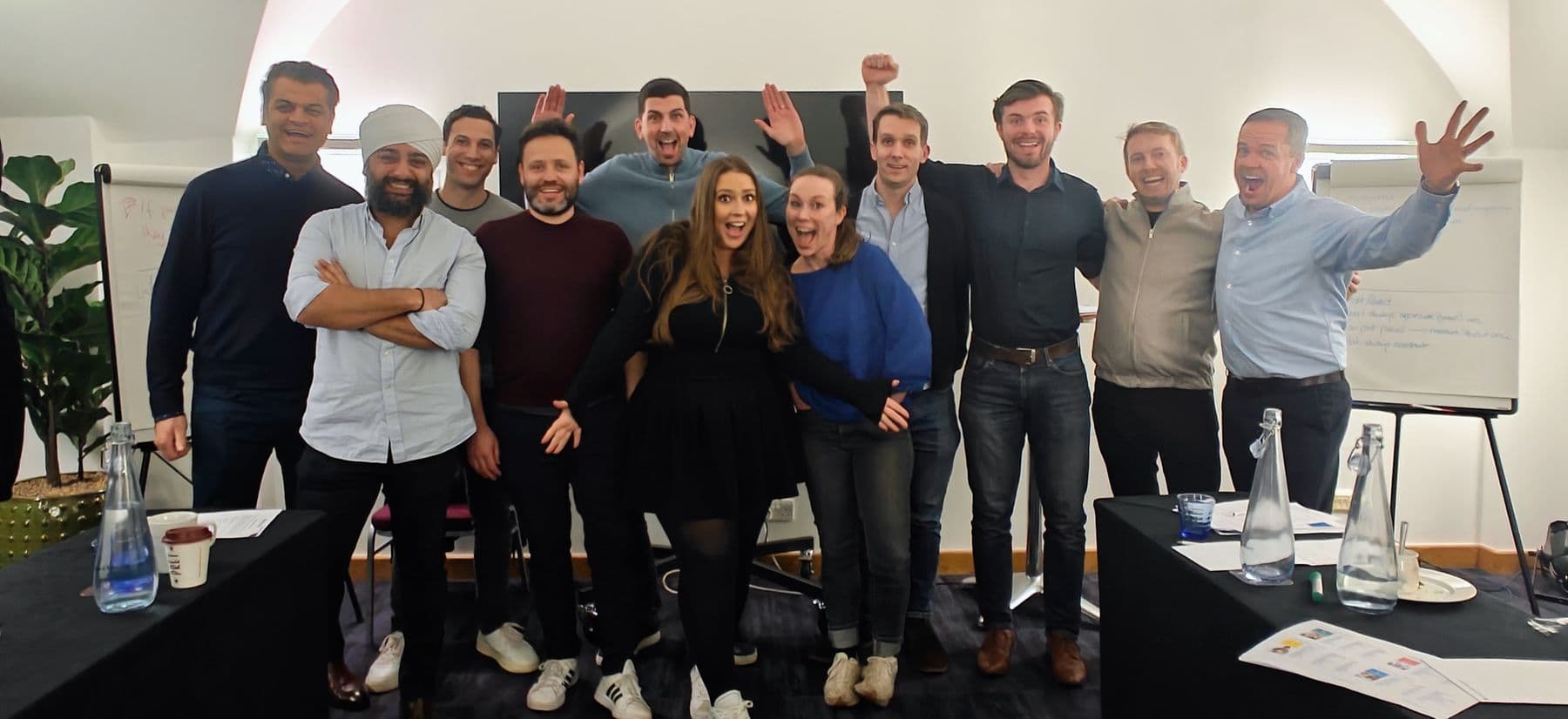 A team cheering together at the end of a session