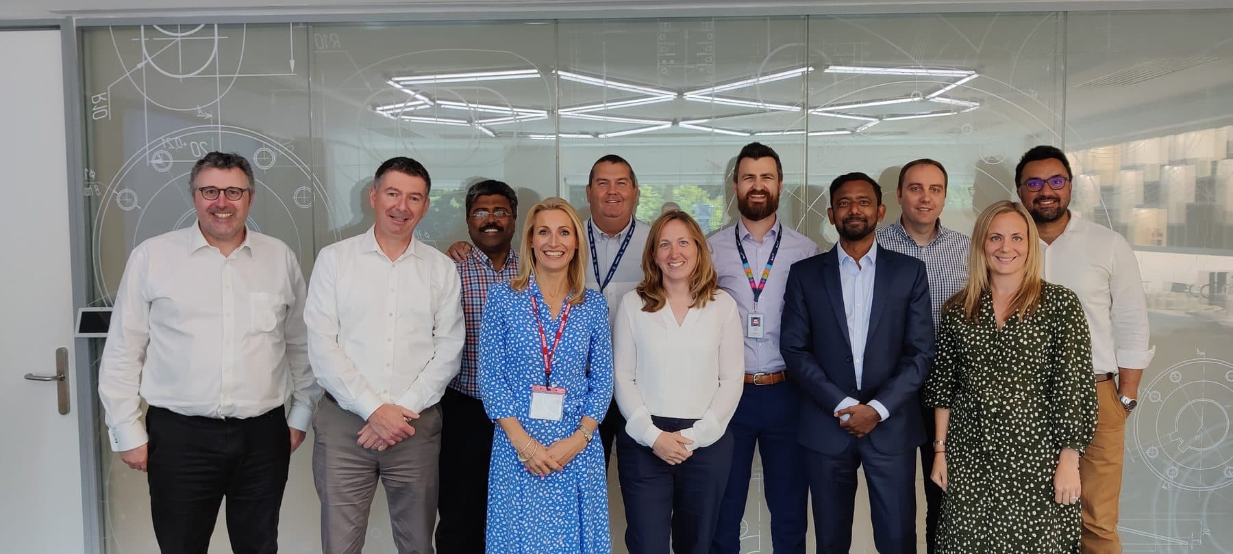 A senior leadership team photographed together at their site